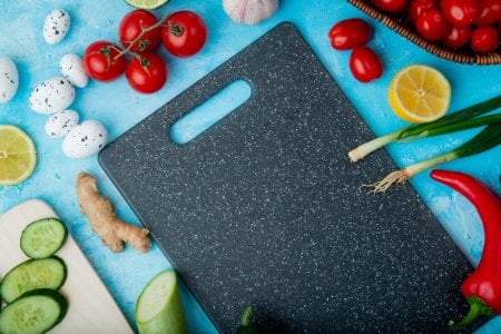 side-view-vegetables-as-ginger-egg-tomato-others-with-lemon-cutting-board-blue-surface_141793-...jpg