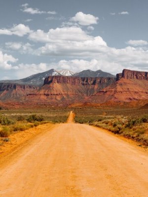 empty-dirt-road-middle-dry-bushes-towards-desert_181624-1505.jpg