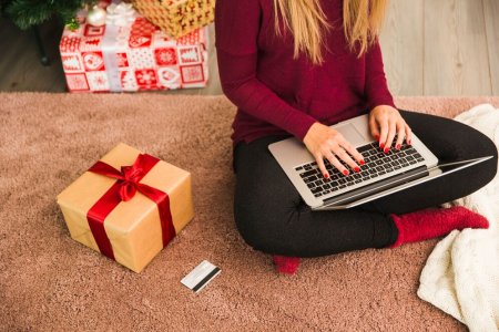lady-with-laptop-near-plastic-card-gift-boxes_23-2147973969.jpg