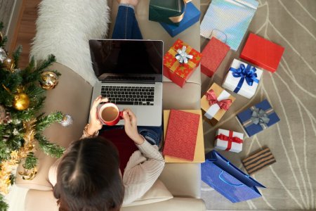 top-view-woman-seated-sofawith-laptop-coffee-surrounded-by-numerous-gift-boxes_1098-18597.jpg