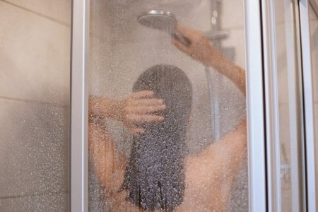 enjoying-shower-back-view-beautiful-young-slim-shirtless-woman-taking-shower-washing-hair-bath...jpg