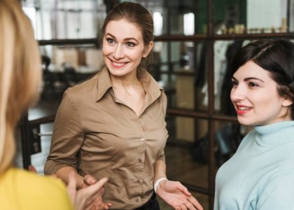 smiley-businesswomen-discussing-indoors_23-2148824838.jpg