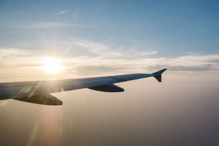 compressed-airplane-wing-sunset-blue-sky.jpeg
