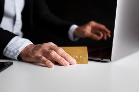 hand-using-card-buy-online-with-laptop.jpg