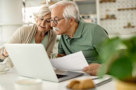 compressed-senior-couple-analyzing-their-savings-while-going-through-home-finances.jpeg