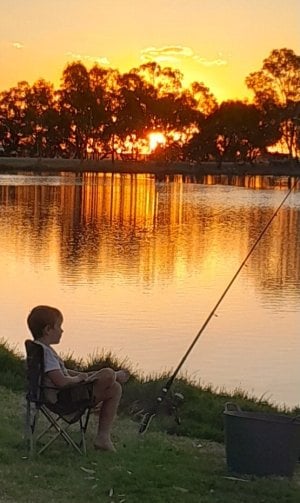 young boy fishing at sunset. Watchem 15.3.24.jpg