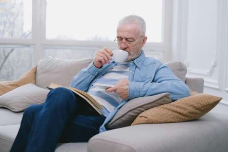 compressed-pexels-old person drinking from a cup.jpeg