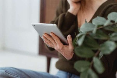compressed-pexels-woman looking at tablet.jpeg