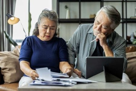 compressed-serious-stressed-asian-senior-old-couple-worried-about-bills-discuss-unpaid-bank-d...jpeg