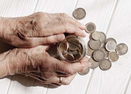 compressed-hands-holding-jar-filled-with-coins.jpeg