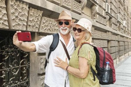 compressed-elderly-couple-taking-selfie-with-phone.jpeg