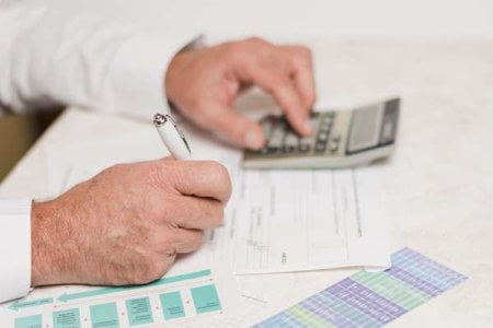compressed-businessman-using-calculator.jpeg compressed-businessman-using-calculator.jpeg