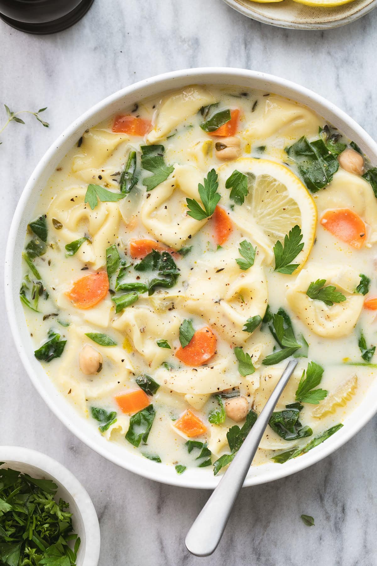 top down view of serving bowl with tortellini soup.