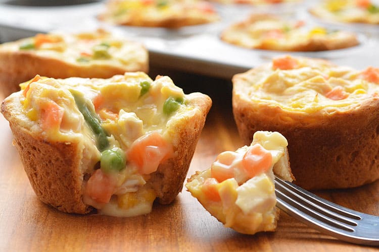 These mini chicken pot pies are SO EASY with only 4 ingredients! Such a fun and delicious 30 minute meal idea when you have a craving for comfort food!