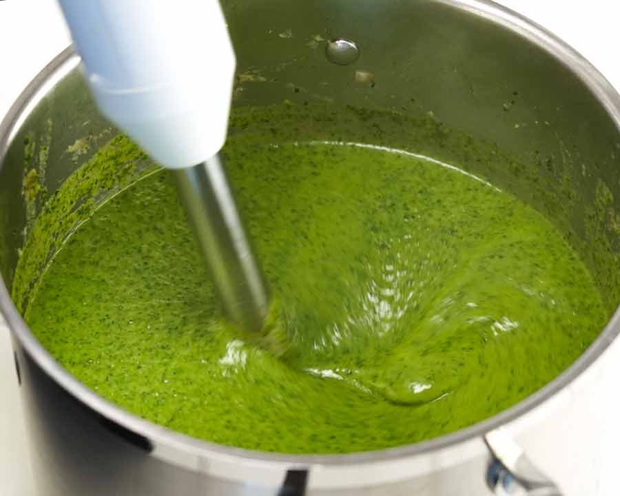 Blitzing Immunity Boosting Green Goddess Soup in a pot